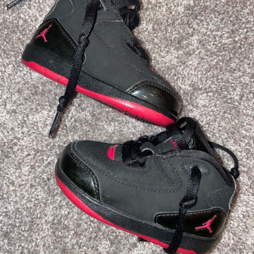 Pink and black baby Nike Jordan’s size 4